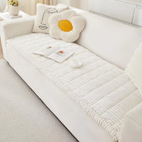 Sofa cover tucked into the seat crease to stop slipping