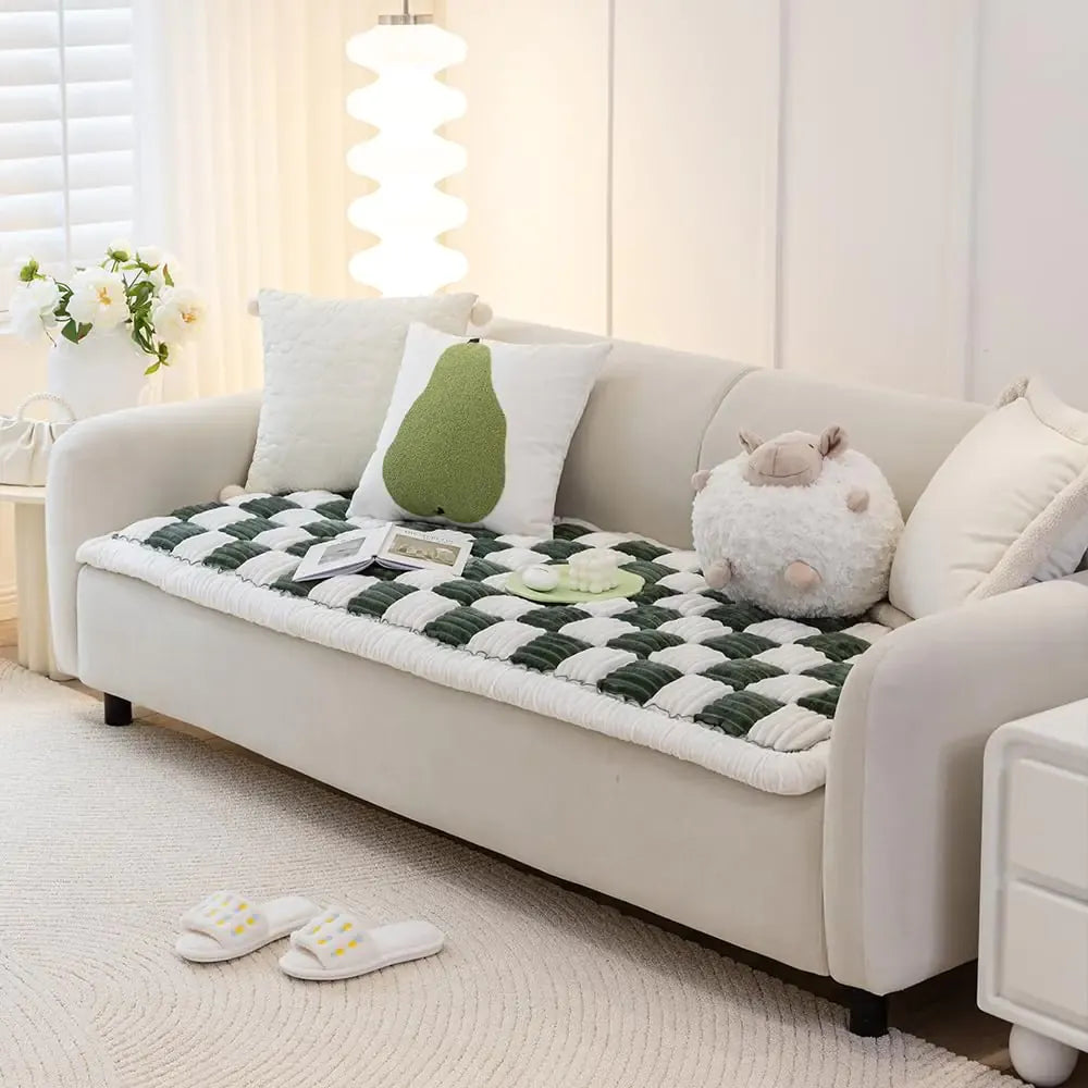 Cream pet sofa cover on a three-seat couch