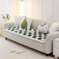 Cream pet sofa cover on a three-seat couch