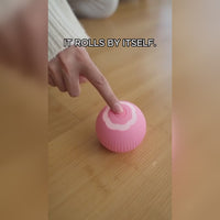 Smart rolling cat ball product demo with a cat